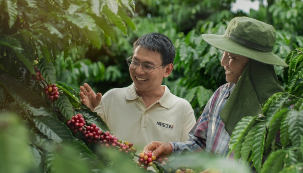 Coffee farmer with Nestle agronomist